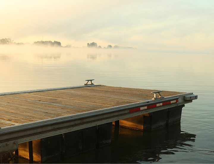 dock-on-a-lake-at-sunset-with-fog-over-the-water